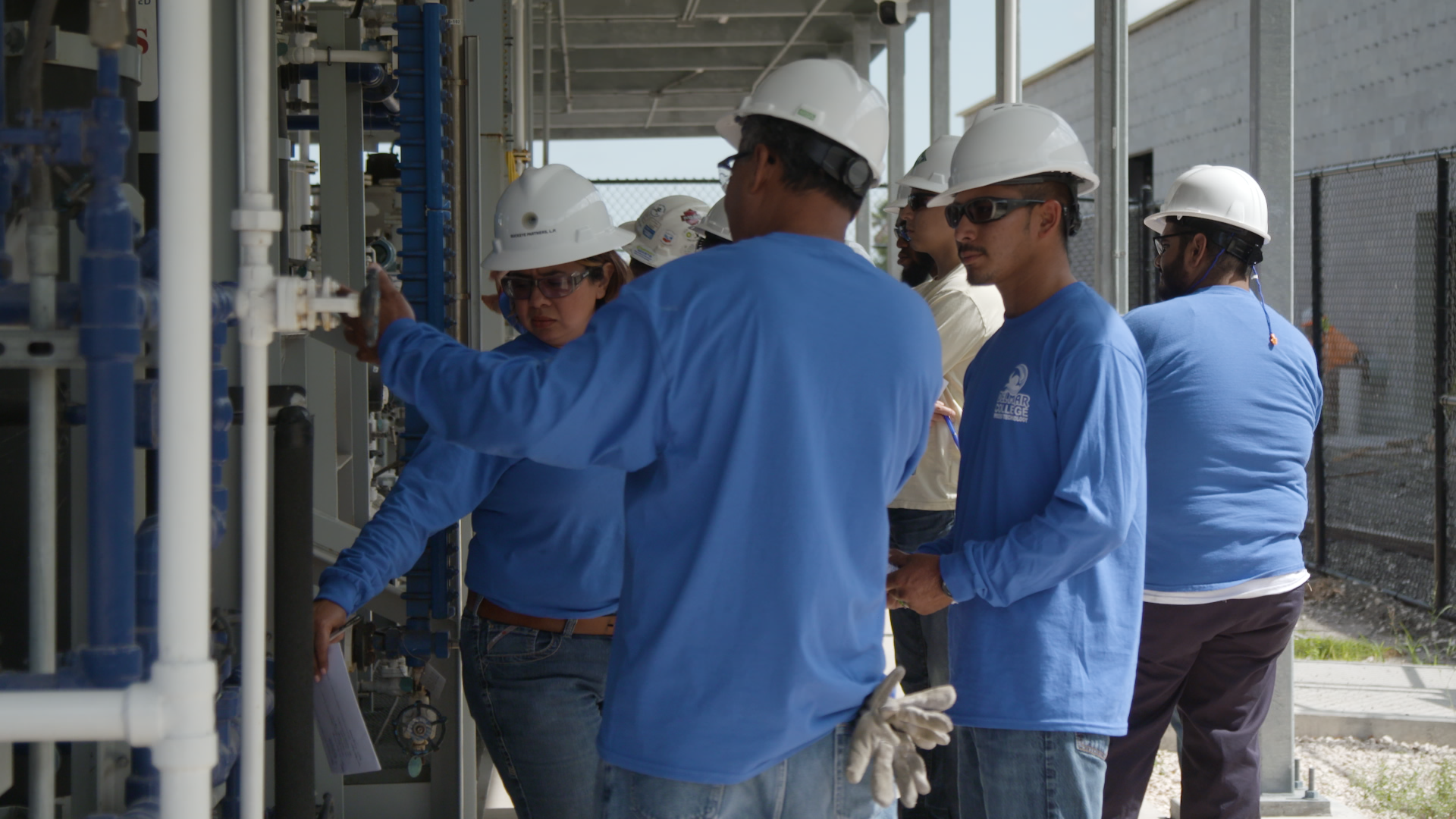 Instructors at Del Mar College in Corpus Christi, Texas, help students learn how to operate the campus’ simulated industrial plant. They’re preparing for jobs like the oil, gas and petrochemical positions headed to the region. (Kyle Pyatt / Newsy)
